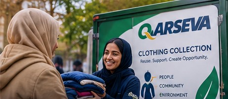 Illustration of a volunteer handing folded clothing to a visitor beside a Qarseva van